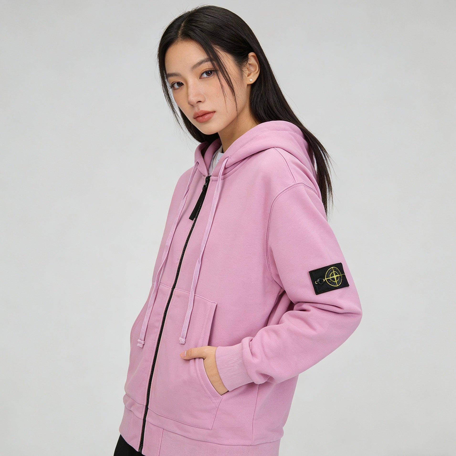 Stone Island pink zip-up hoodie with front zipper, hood, and side pocket