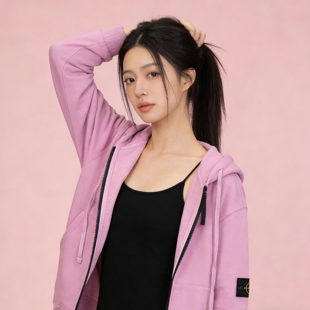 Stone Island pink zip-up hoodie with hood and front zipper; black top underneath