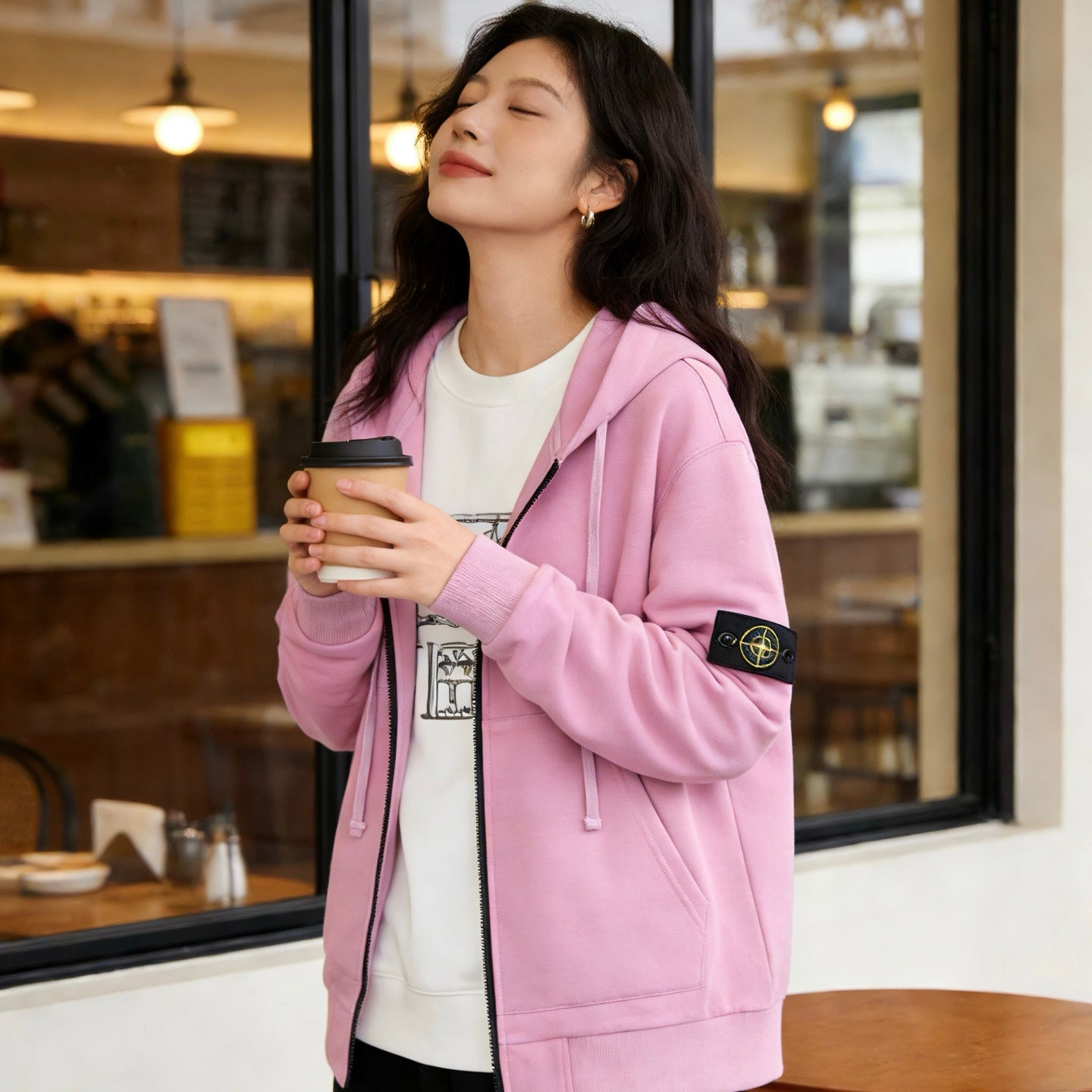 Stone Island pink zip-up hoodie with hood, front zipper, and sleeve patch