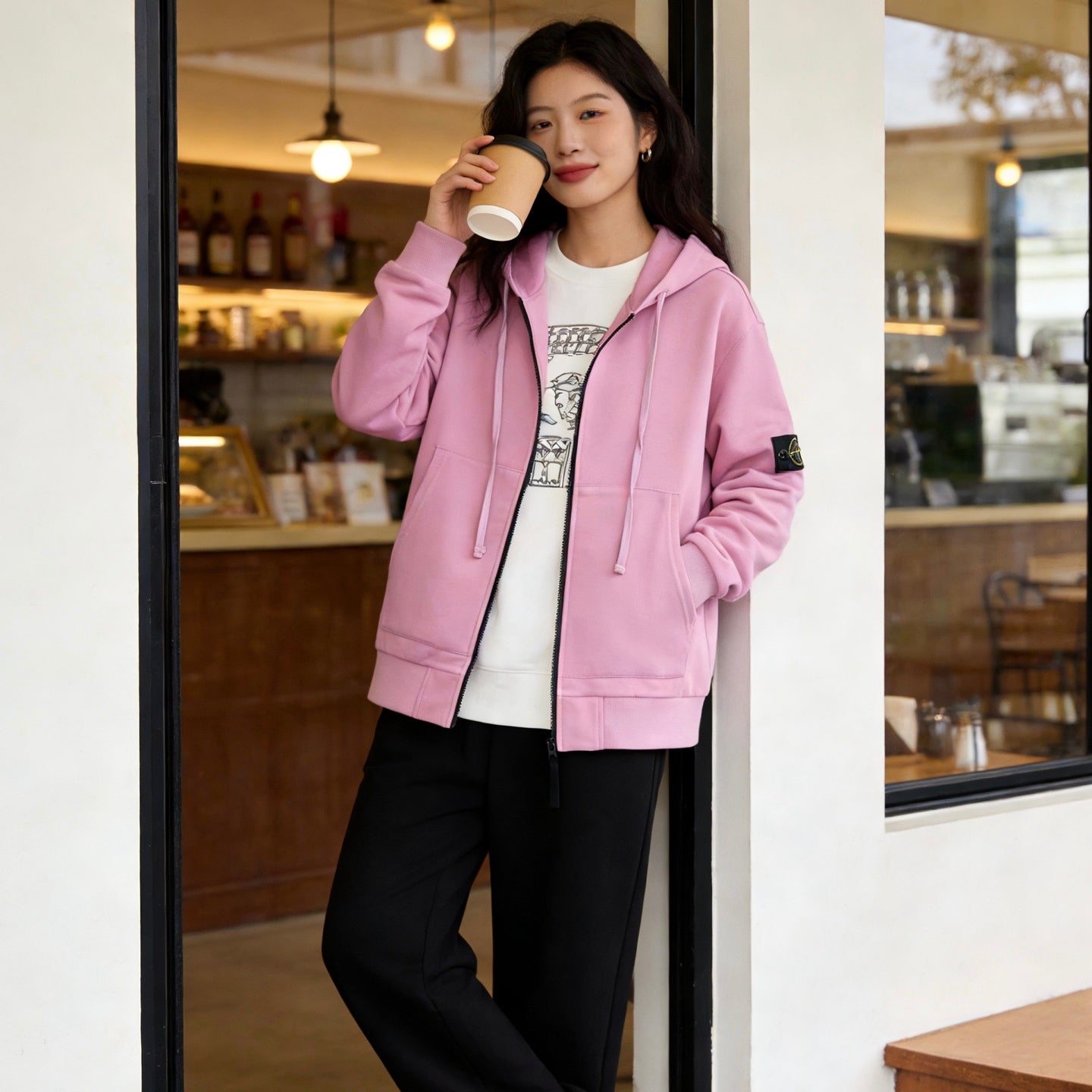 Stone Island pink zip-up hoodie with hood, front zipper, and kangaroo pocket