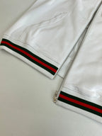 Gucci white zip hoodie with striped waistband near zipper