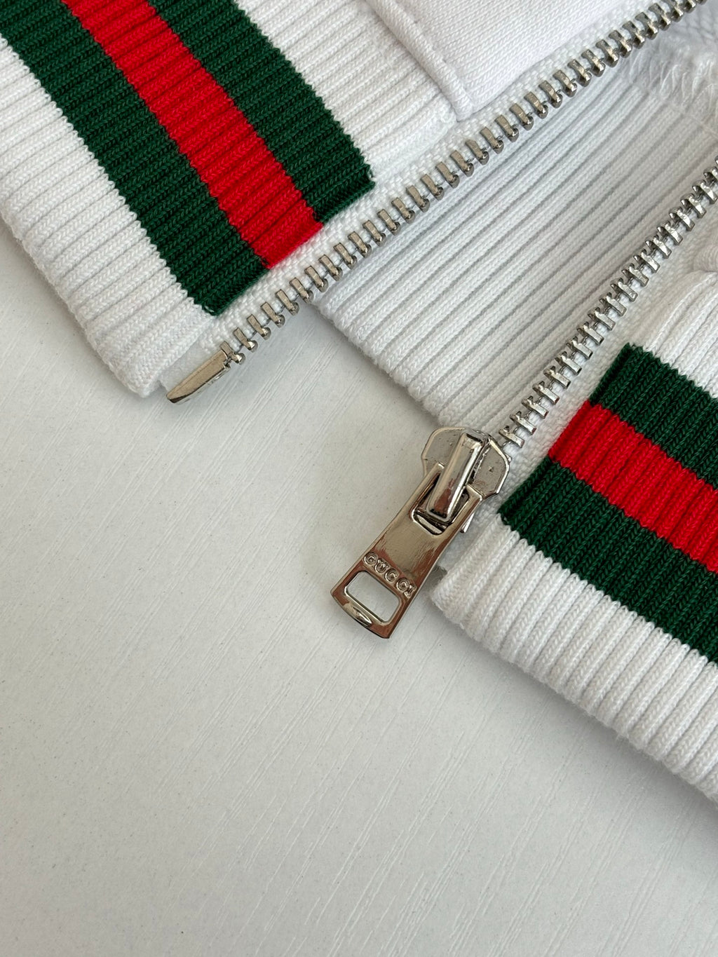 Gucci white zip hoodie with striped knit bands and silver zipper details