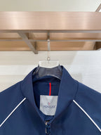 Dark navy zip jacket with stand collar and white inner logo label