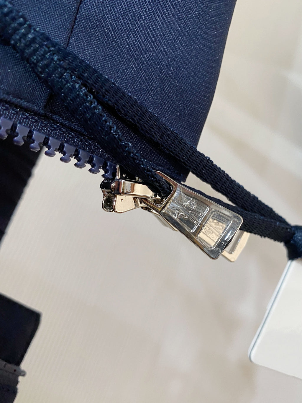 Navy jacket zipper with metal pull
