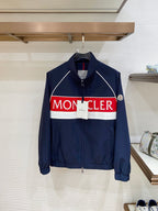 Navy zip-front jacket with white piping and red/white logo band