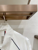 White long jacket sleeve with navy contrast piping