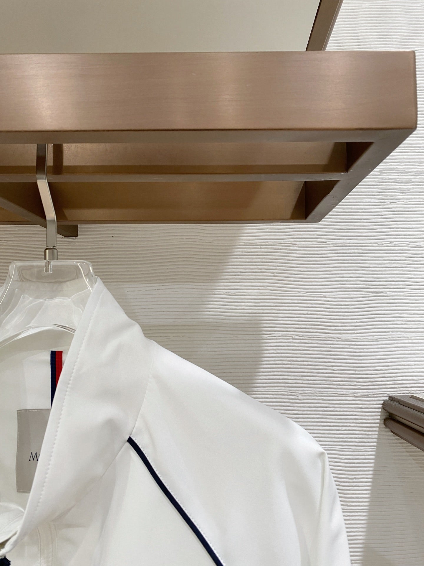 White long jacket sleeve with navy contrast piping