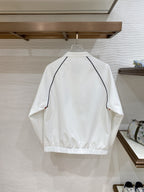 White long jacket back with navy-trim curved yoke and zipper hem