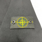 Stone Island chest logo patch with yellow compass emblem and side buttons