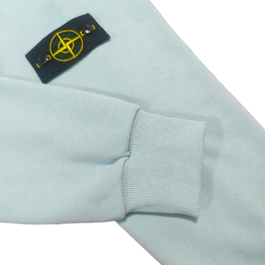 Stone Island light blue zip-up hoodie with ribbed cuff and chest logo patch
