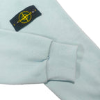 Stone Island light blue zip-up hoodie with ribbed cuff and chest logo patch