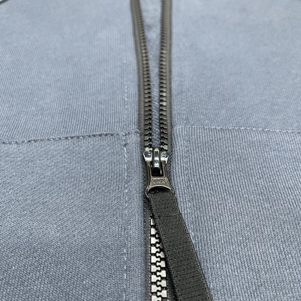 Stone Island zip-up hoodie close-up of metal zipper and fabric seam