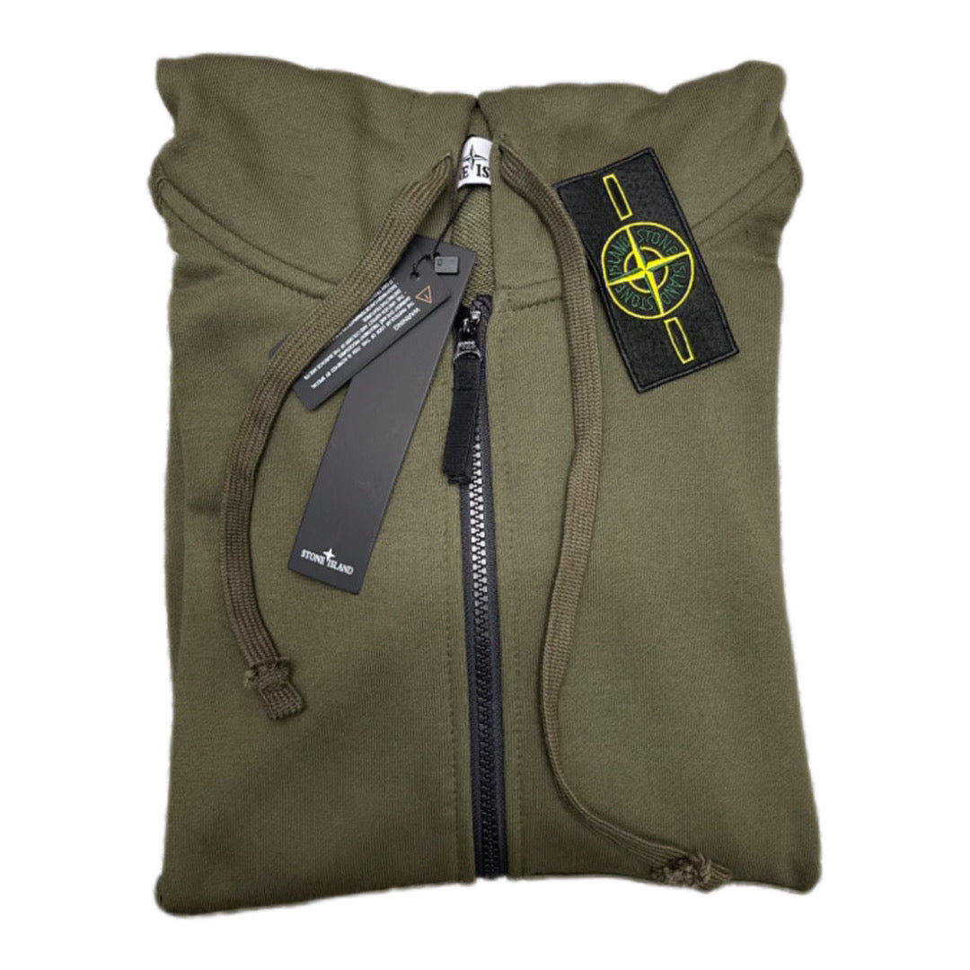 Olive hooded zip-up hoodie close-up with chest badge and drawstrings