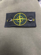 Olive zip-up hoodie chest patch with Stone Island compass emblem