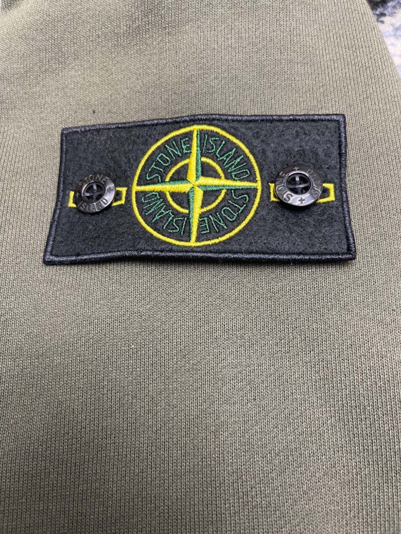 Olive zip-up hoodie chest patch with Stone Island compass emblem