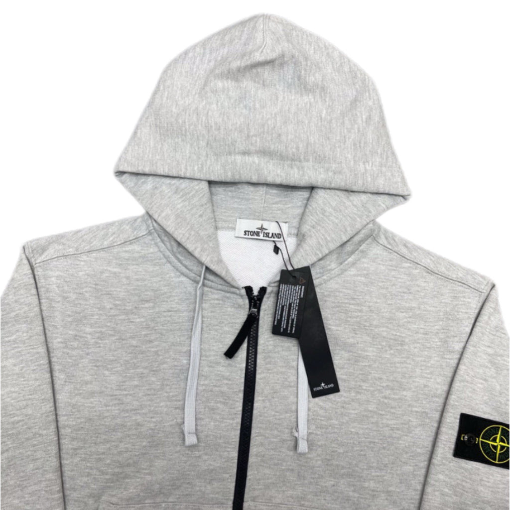 Stone Island zip hoodie, light gray marl with hood, white drawstrings, and black center zip.