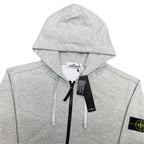 Stone Island zip hoodie, light gray marl with hood, white drawstrings, and black center zip.