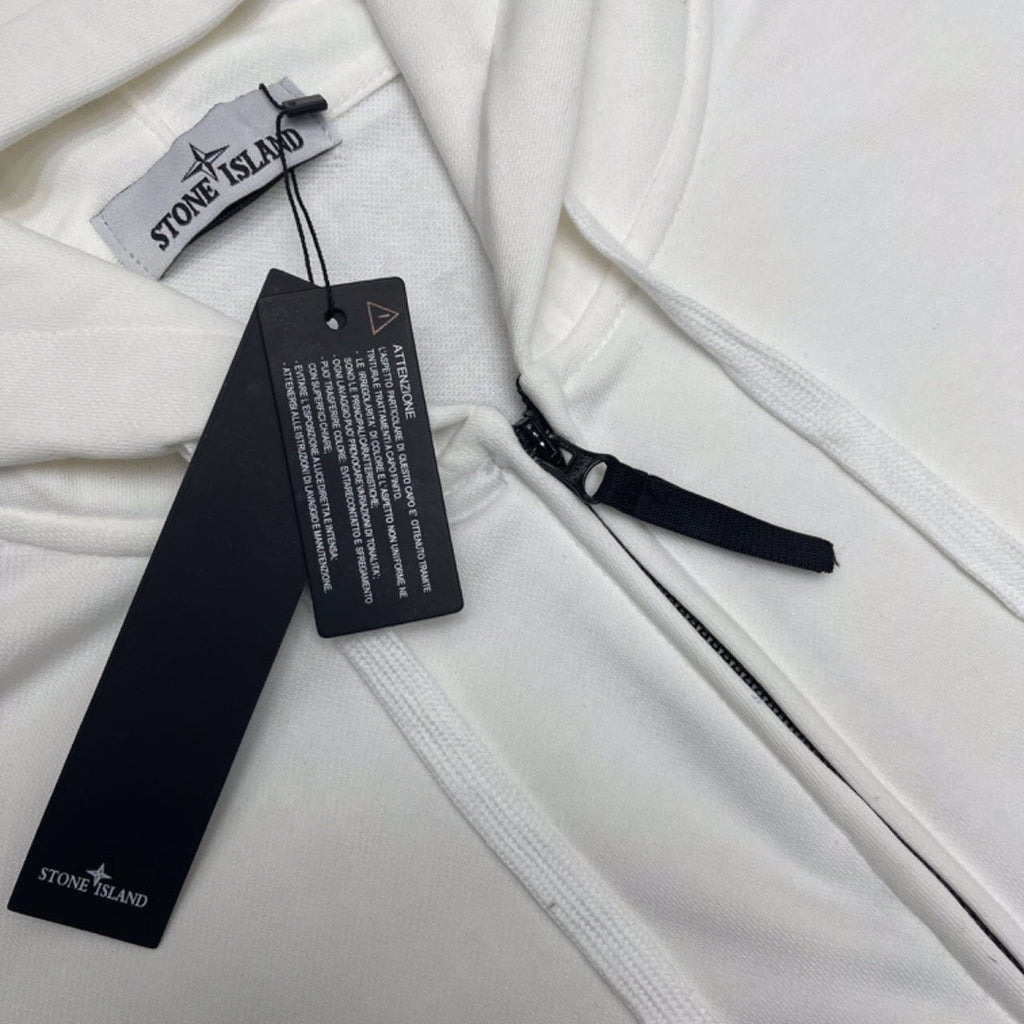 White Stone Island zip hoodie with hang tags and drawcord details
