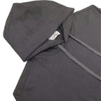 Dark hooded sweatshirt hood and sleeve close-up with drawstring cord