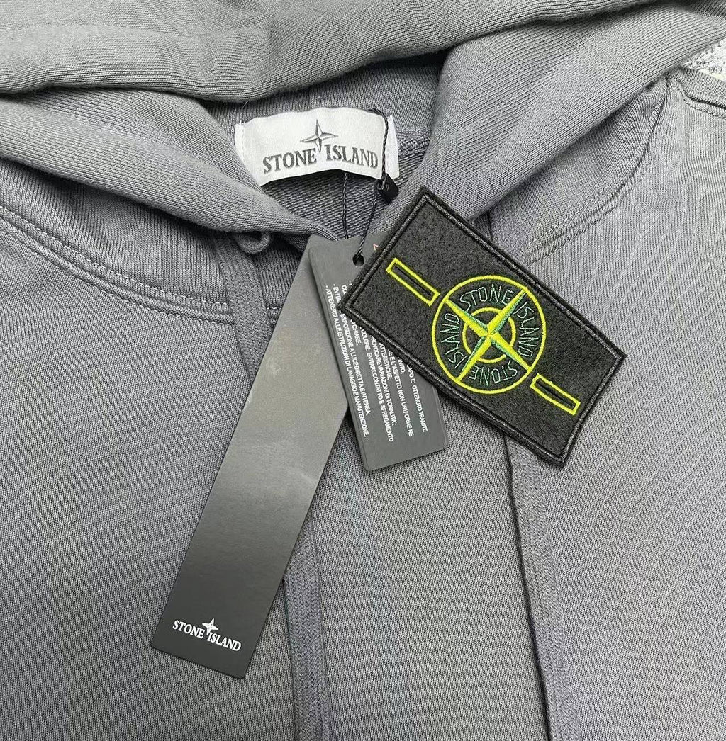 Gray hoodie with hood drawstrings and logo patch near center front
