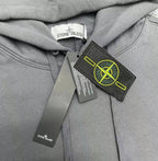 Gray hoodie with hood drawstrings and logo patch near center front