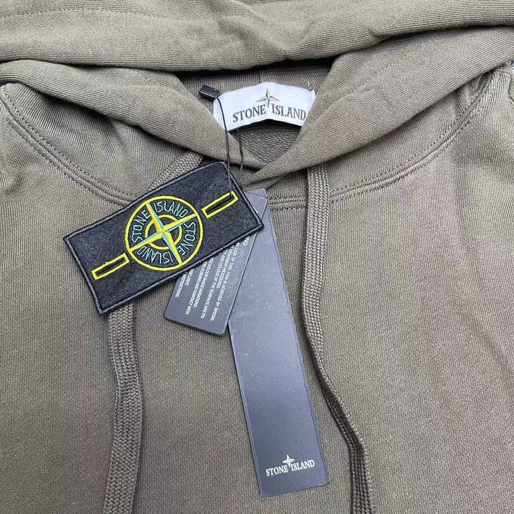 Stone Island olive hoodie close-up of hood and drawstrings with label tags