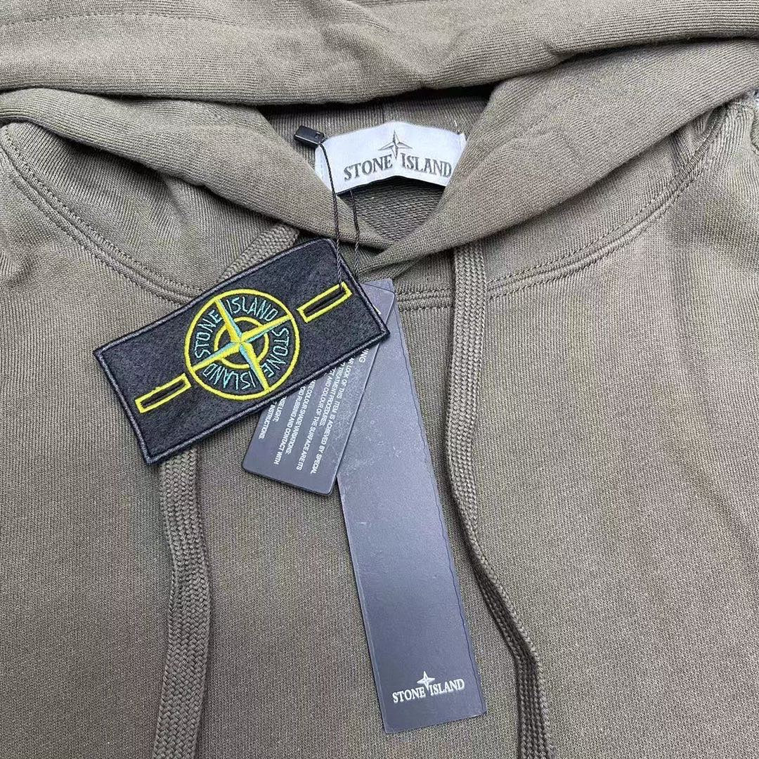 Stone Island olive hoodie close-up of hood and drawstrings with label tags