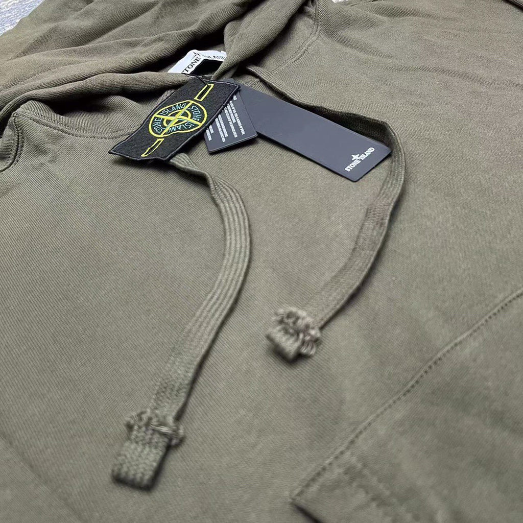 Stone Island olive hoodie close-up of drawcords and small logo at chest