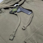 Stone Island olive hoodie close-up of drawcords and small logo at chest