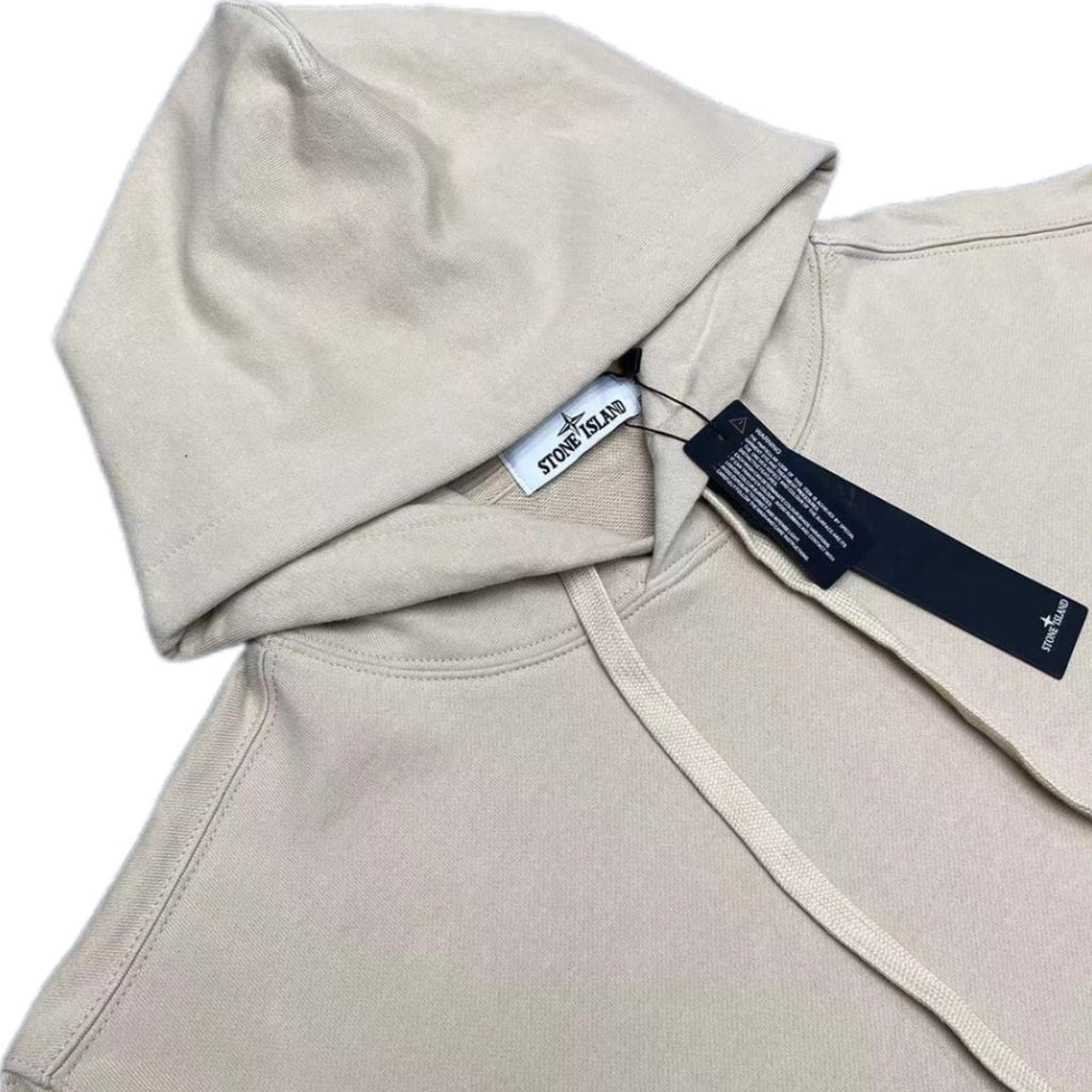 Hoodie neckline close-up with drawstring and inner brand label