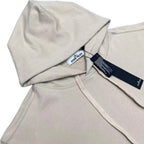 Hoodie neckline close-up with drawstring and inner brand label