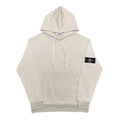 Cream pullover hoodie with drawstring hood, pouch pocket, and left sleeve badge