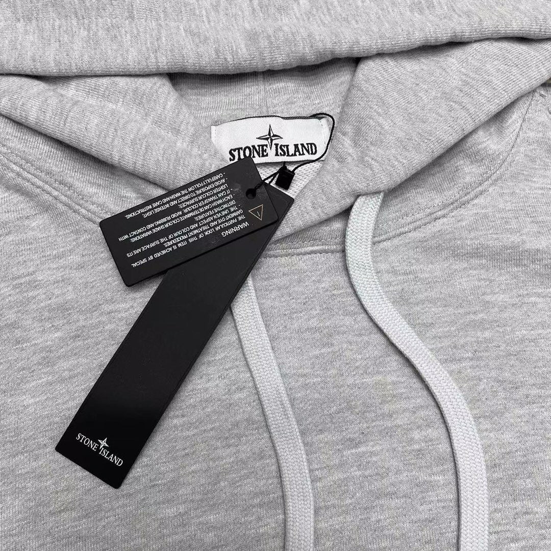 Stone Island gray hoodie close-up of chest tags and light drawstring
