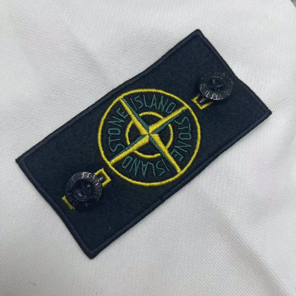 Stone Island logo patch in navy with yellow graphic on white hoodie