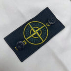 Stone Island logo patch in navy with yellow graphic on white hoodie