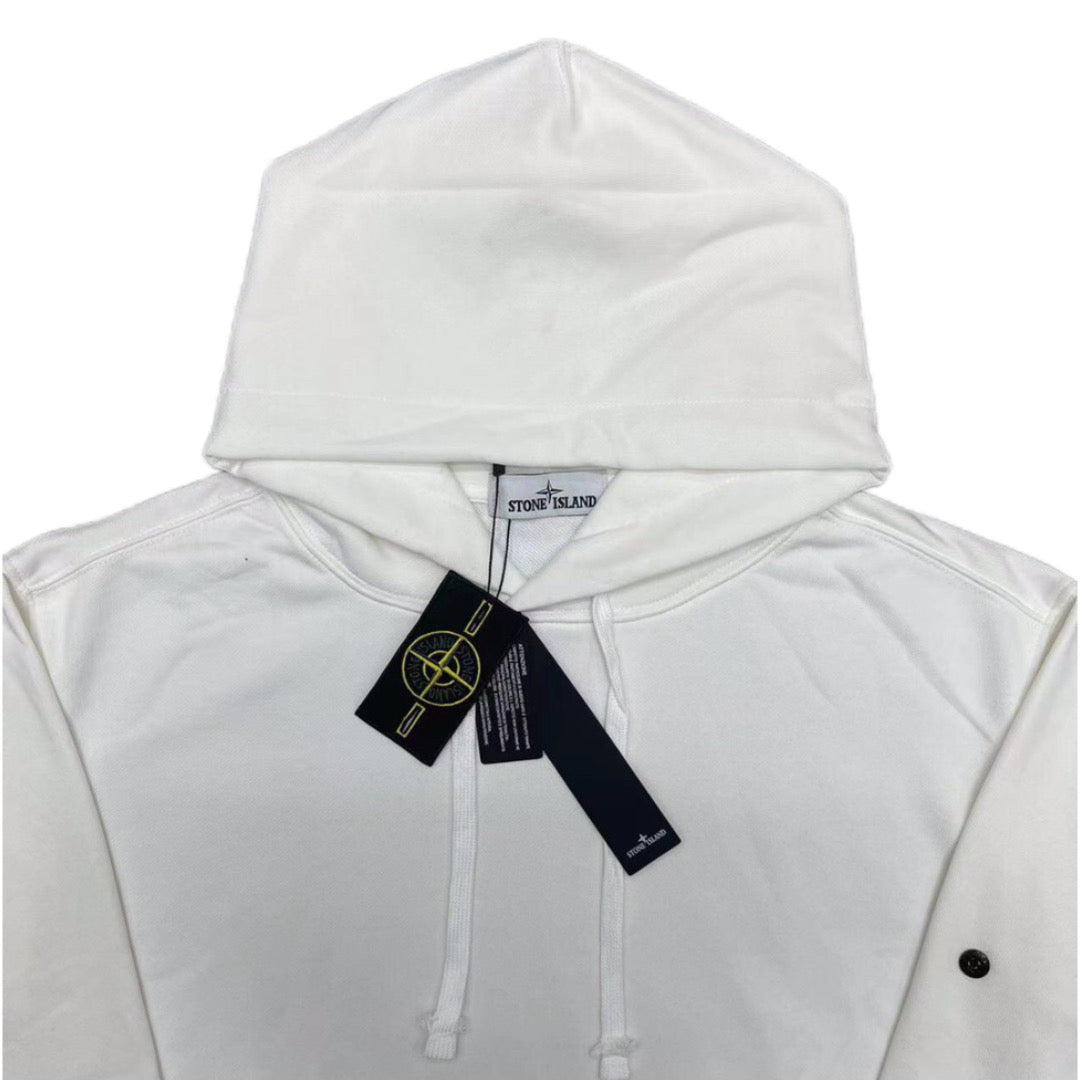White Stone Island hoodie hood with front drawstrings and logo patch, tags attached