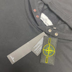 Gray hooded sweatshirt close-up of neck label and snap-button placket