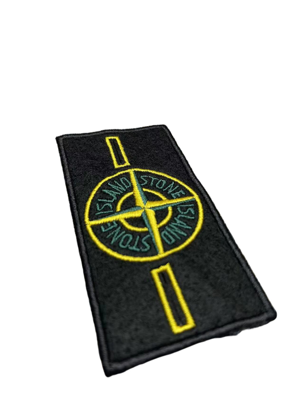 Stone Island logo embroidered patch with yellow emblem on black backing fabric