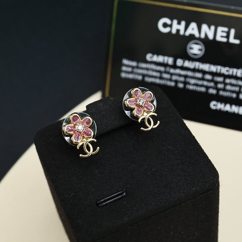 Chanel floral stud earrings with pink stones and gold-tone CC logo
