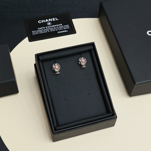 Pair of Chanel floral stud earrings in black gift box, pink stones, gold-tone CC
