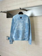 Light blue tie-dye crewneck sweatshirt with stacked logo graphic on back