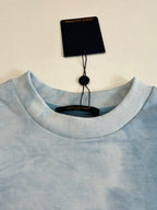 Light blue ribbed crewneck sweatshirt collar with Louis Vuitton neck label