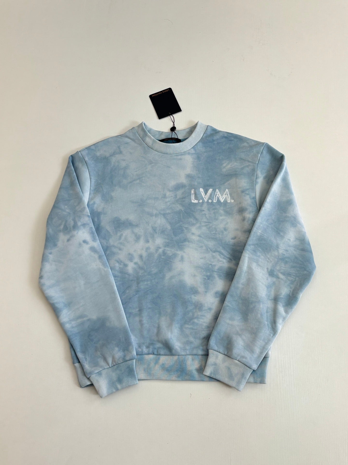 Light blue tie-dye crewneck sweatshirt with LV monogram logo on front