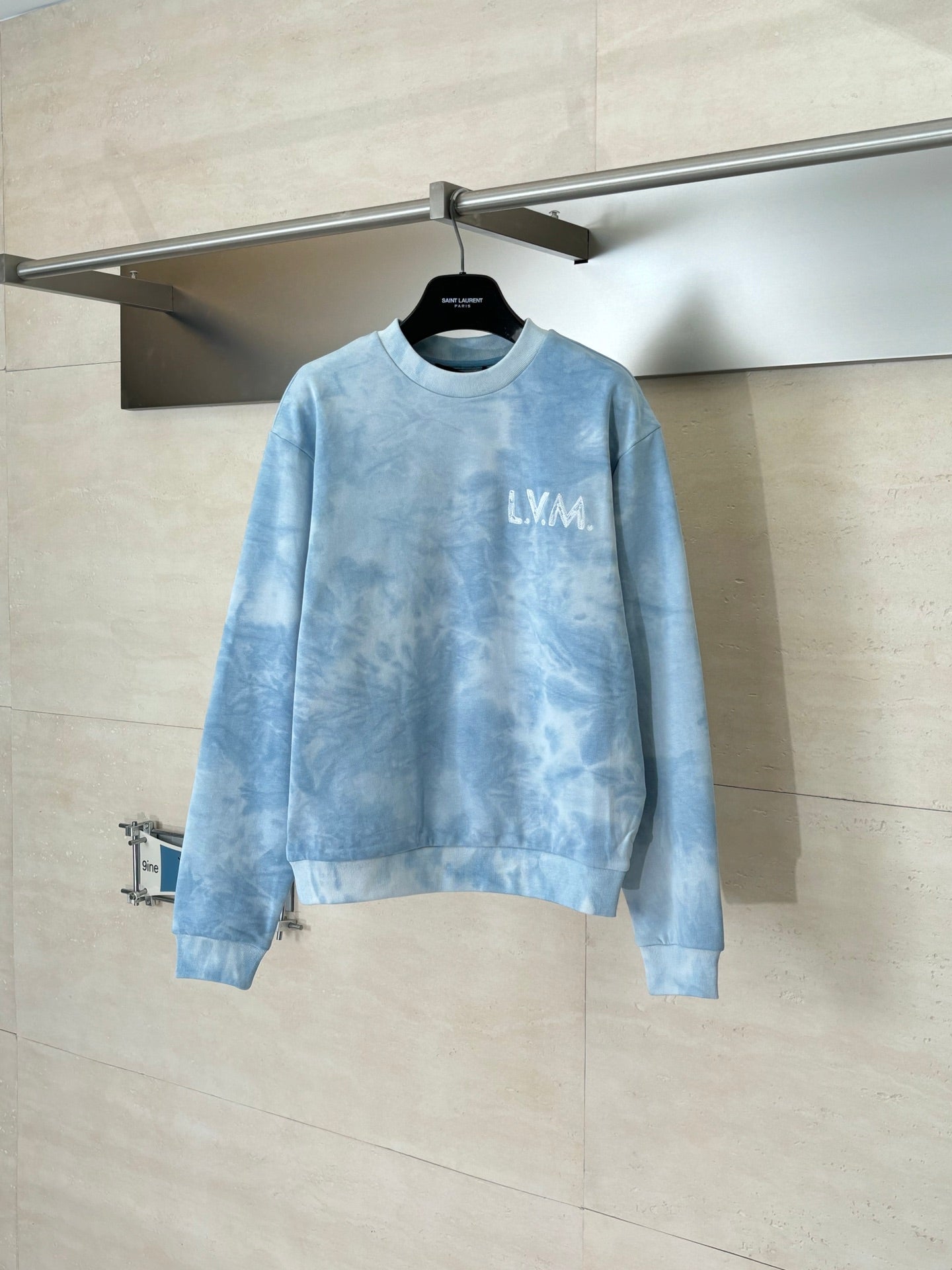 Light blue tie-dye crewneck sweatshirt with LV logo on chest