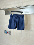 Navy shorts with elastic waistband and gathered front with drawstring