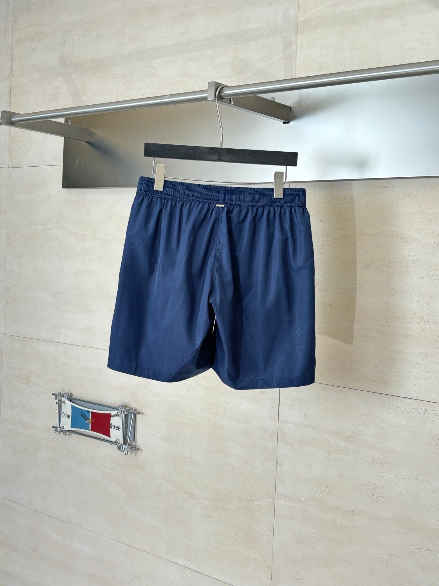 Navy shorts with elastic waistband and gathered front with drawstring