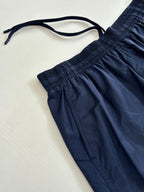 Navy shorts detail with drawstring tie and gathered elastic waistband