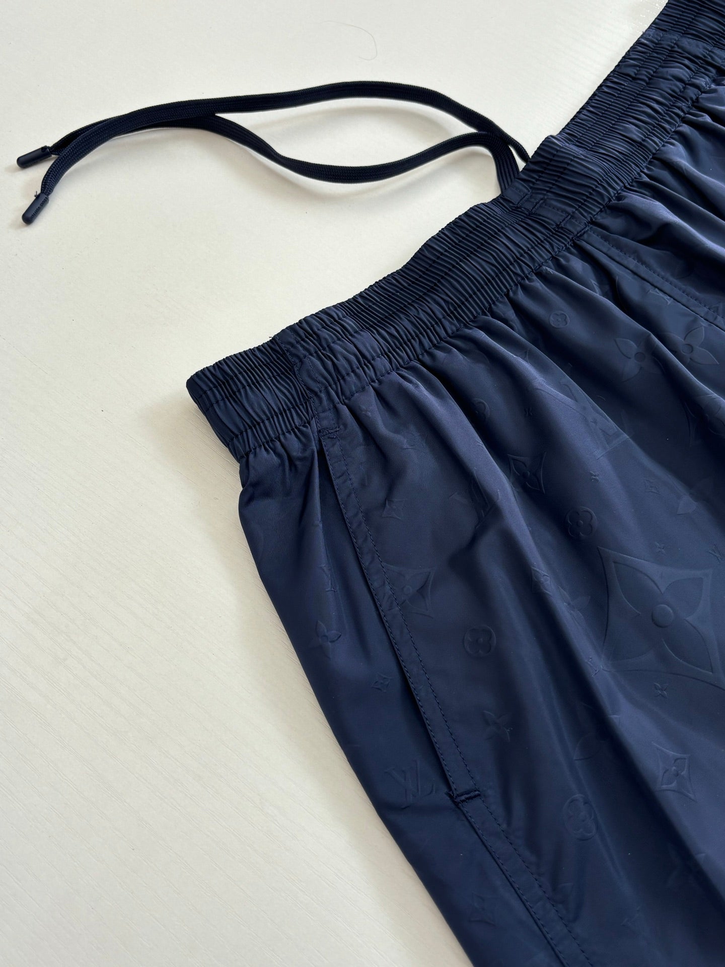 Navy shorts detail with drawstring tie and gathered elastic waistband