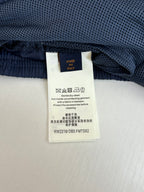 Navy pants waistband with fabric label and elastic waist