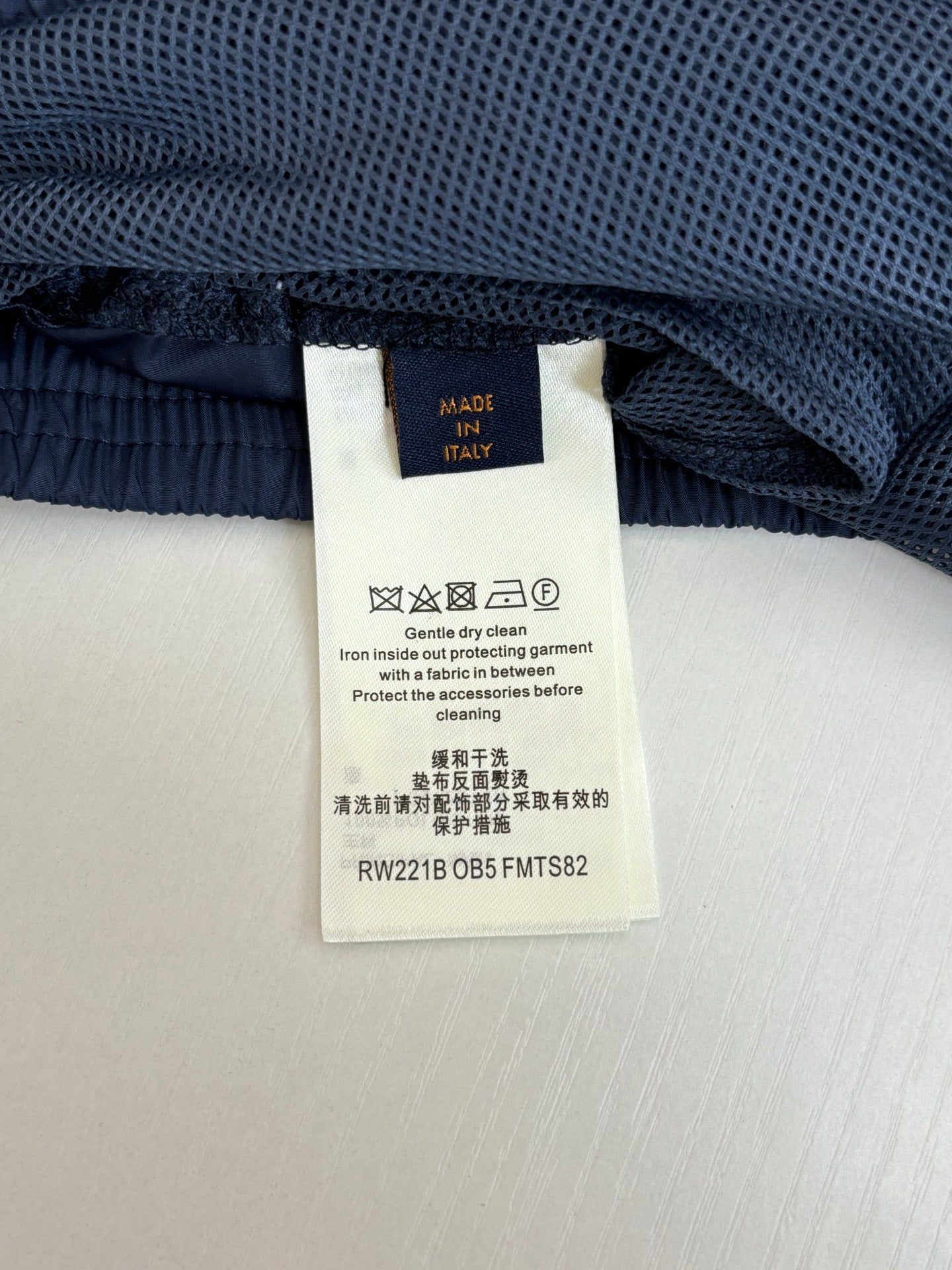 Navy pants waistband with fabric label and elastic waist